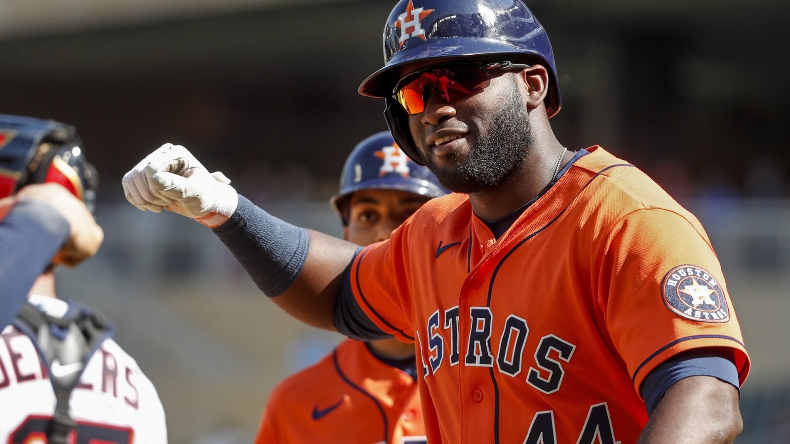 Houston Astros designated hitter Yordan Alvarez raises his right hand in celebration after hitting a home run May 12, 2022, in Minneapolis.