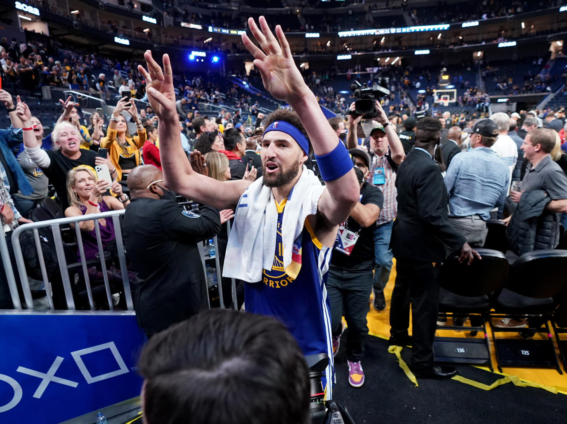 Golden State Warriors guard Klay Thompson, center, holds up eight fingers to the crowd while walking off the court after hitting eight 3-pointers against the Memphis Grizzlies on May 13, 2022, in San Francisco.