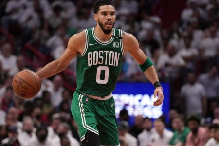 Boston Celtics forward Jayson Tatum (0) dribbles up the court against the Miami Heat during the first half of game one of the 2022 eastern conference finals at FTX Arena.