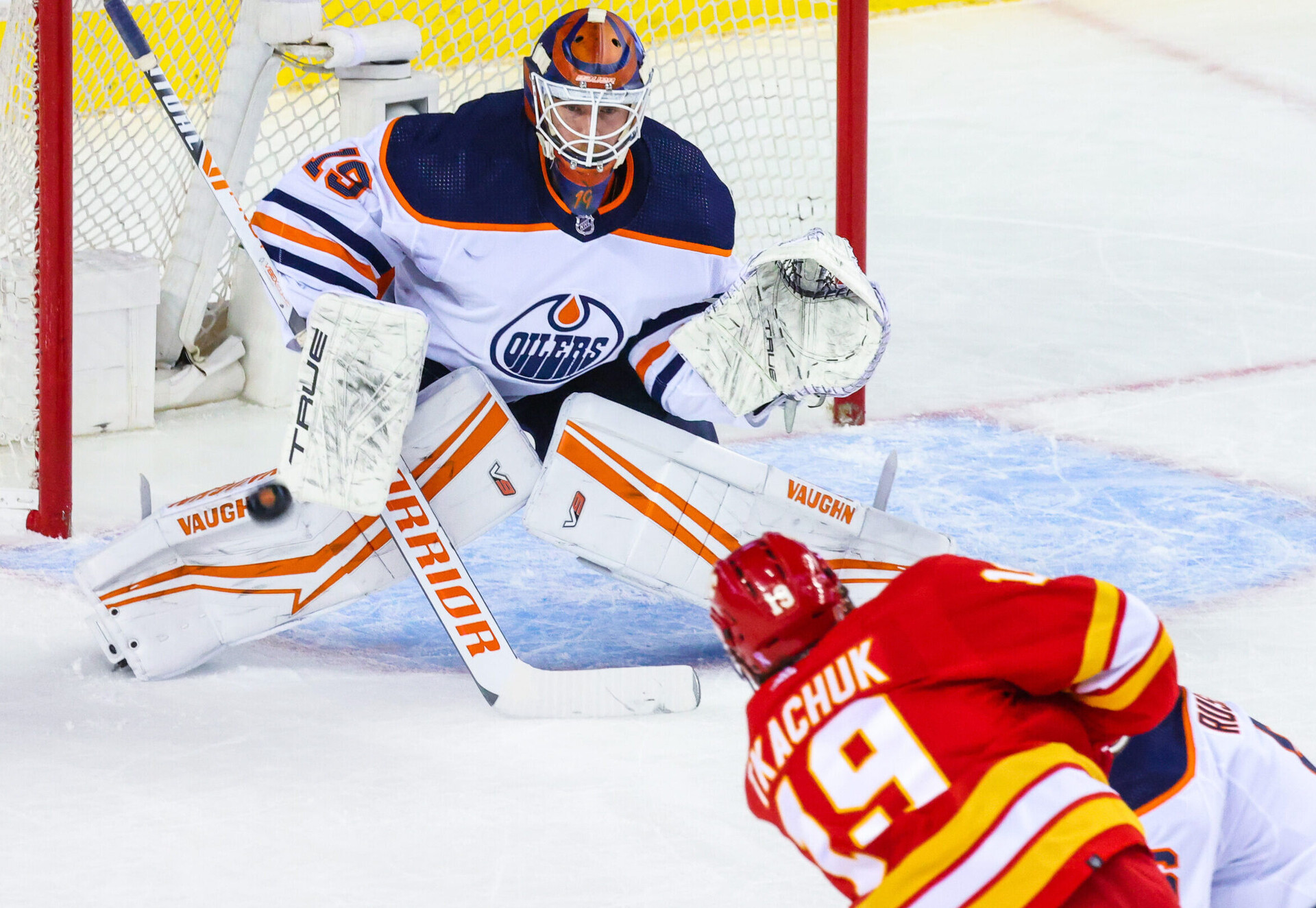 Edmonton Oilers goaltender Mikko Koskinen gets in position to make a save against Calgary Flames left wing Matthew Tkachuk during the first period in game one of the second round of the 2022 Stanley Cup Playoffs