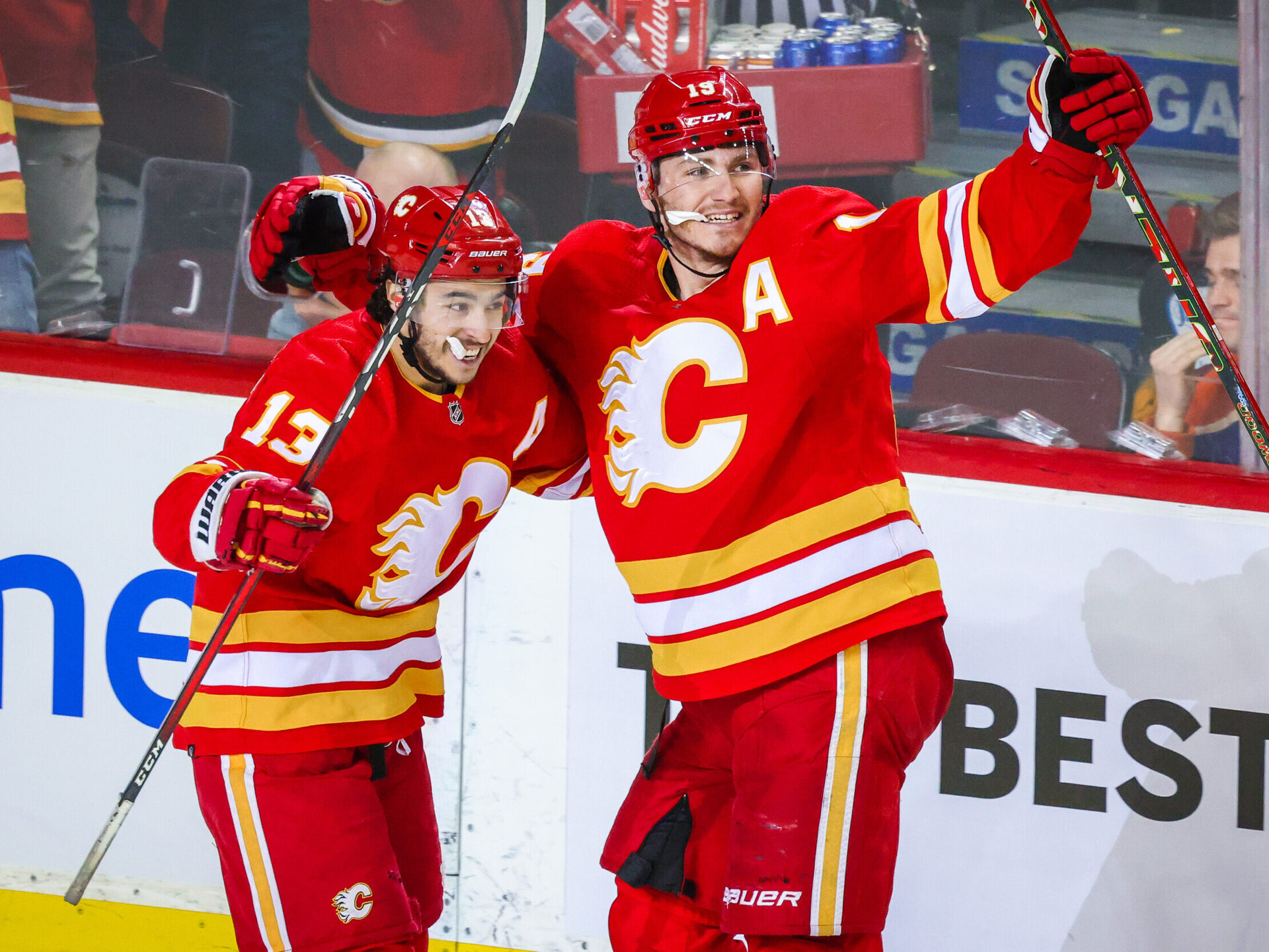 Calgary Flames left wing Matthew Tkachuk (right) celebrates his goal with teammate Johnny Gaudreau (left) during the third period against the Edmonton Oilers in game one of the second round of the 2022 Stanley Cup Playoffs