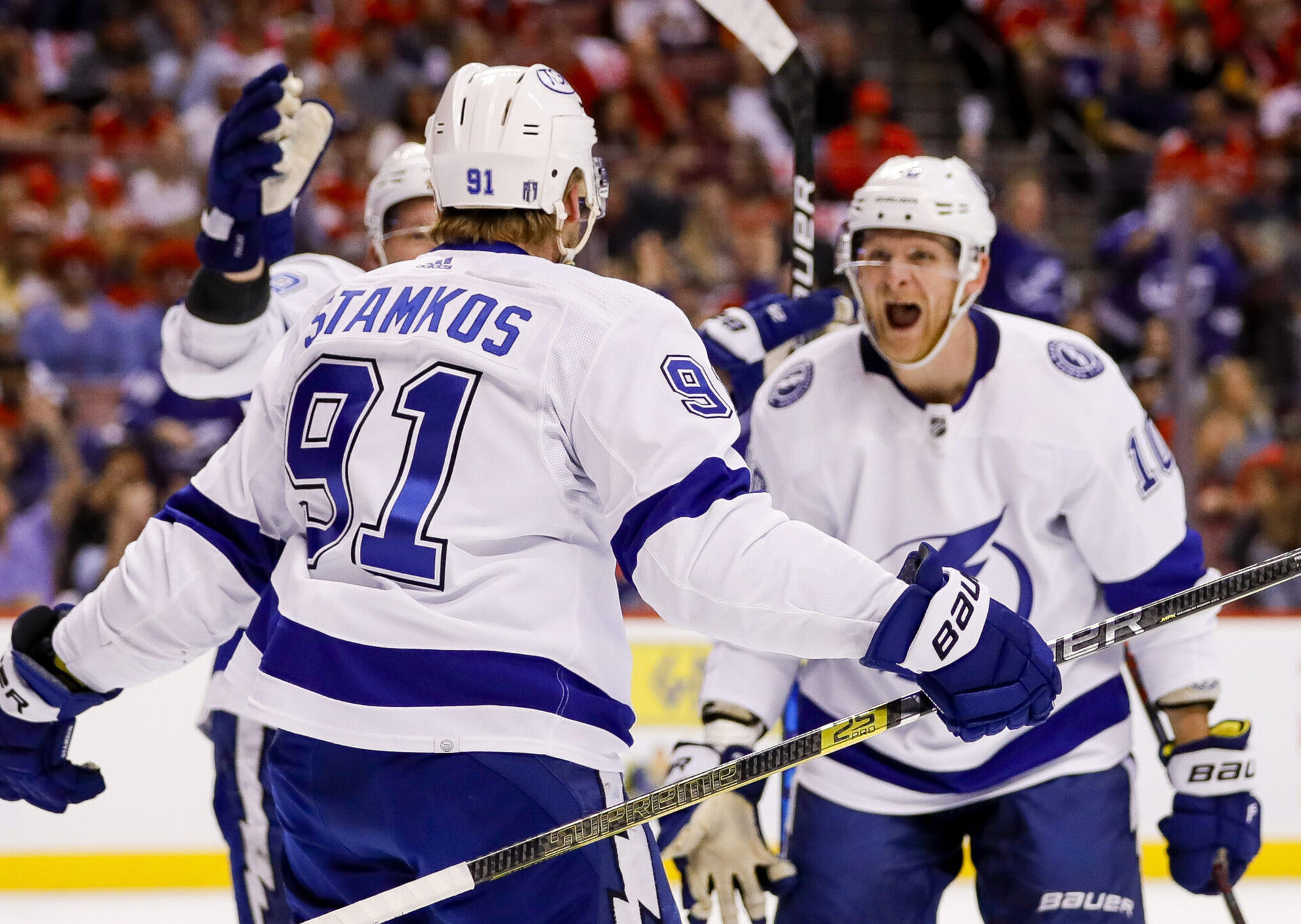 Tampa Bay Lightning right wing Corey Perry (right) celebrates with center Steven Stamkos (center, back turned) after scoring against the Florida Panthers during the first period in game two of the second round of the 2022 Stanley Cup Playoffs