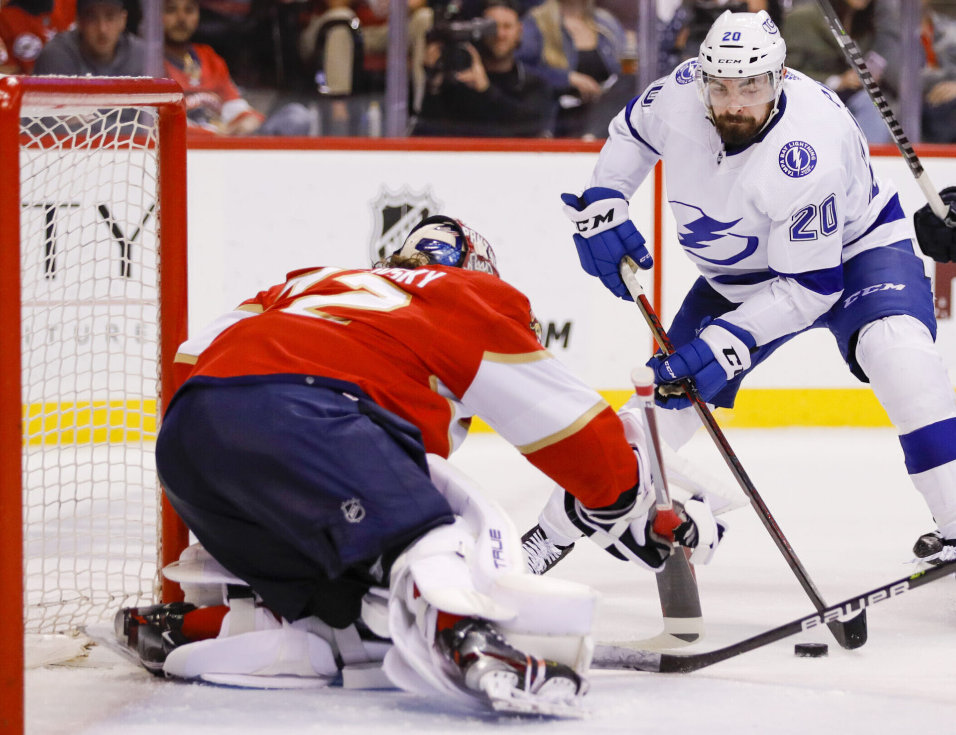 Tampa Bay Lightning left wing Nicholas Paul (center) controls the puck and looks to shoot it past Florida Panthers goaltender Sergei Bobrovsky (72) during the third period in game two of the second round of the 2022 Stanley Cup Playoffs