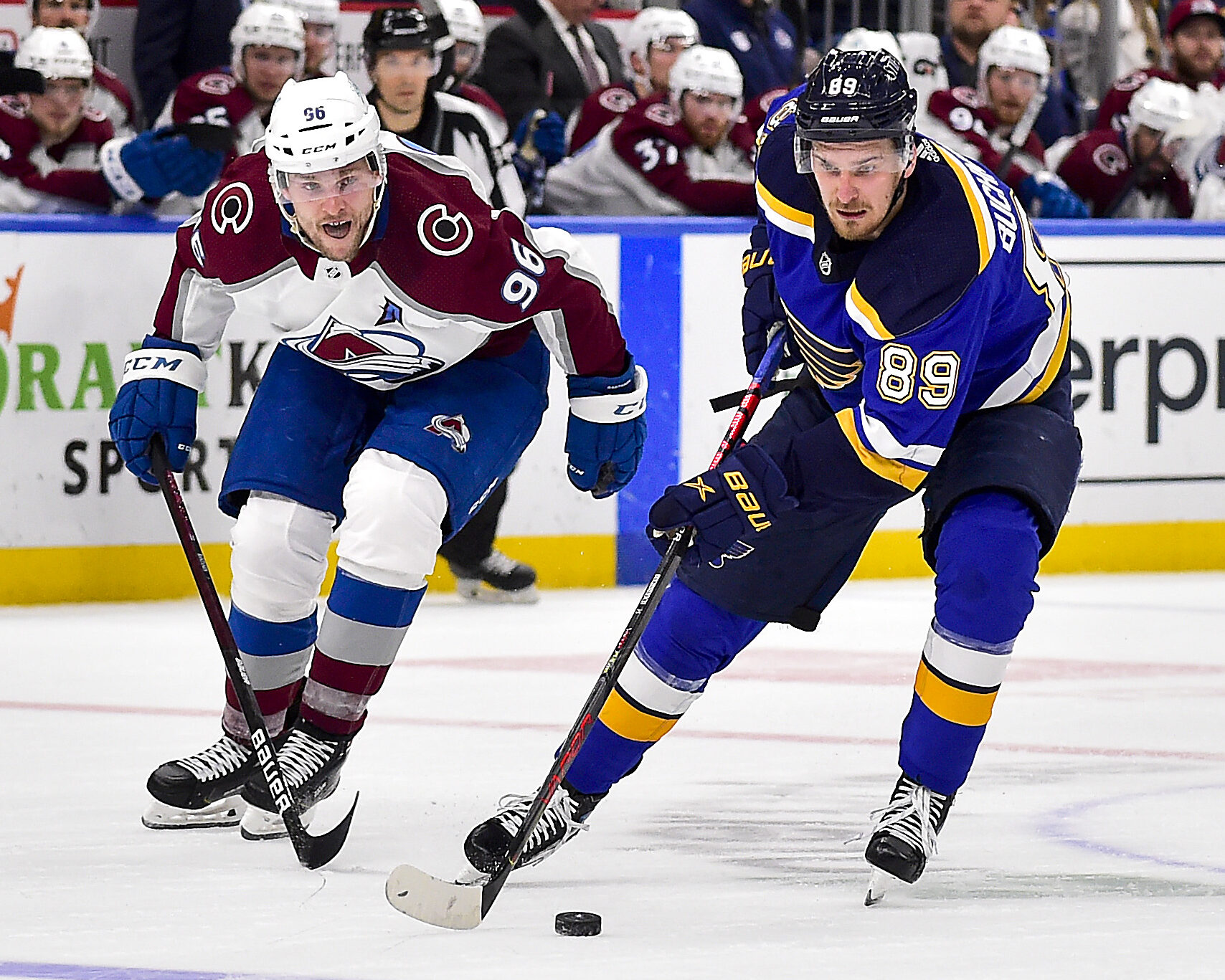St. Louis Blues left wing Pavel Buchnevich (right) controls the puck as Colorado Avalanche right wing Mikko Rantanen (left) defends during Game 3 of the second round of the 2022 Stanley Cup Playoffs
