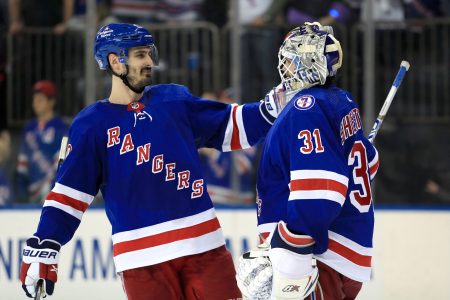 New York Rangers left wing Chris Kreider (left) celebrates a 3-1 win over the Carolina Hurricanes with New York Rangers goalie Igor Shesterkin (right) in Game 3 of the second round of the 2022 Stanley Cup Playoffs