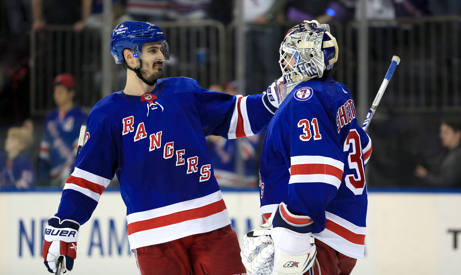 New York Rangers left wing Chris Kreider (left) celebrates a 3-1 win over the Carolina Hurricanes with New York Rangers goalie Igor Shesterkin (right) in Game 3 of the second round of the 2022 Stanley Cup Playoffs