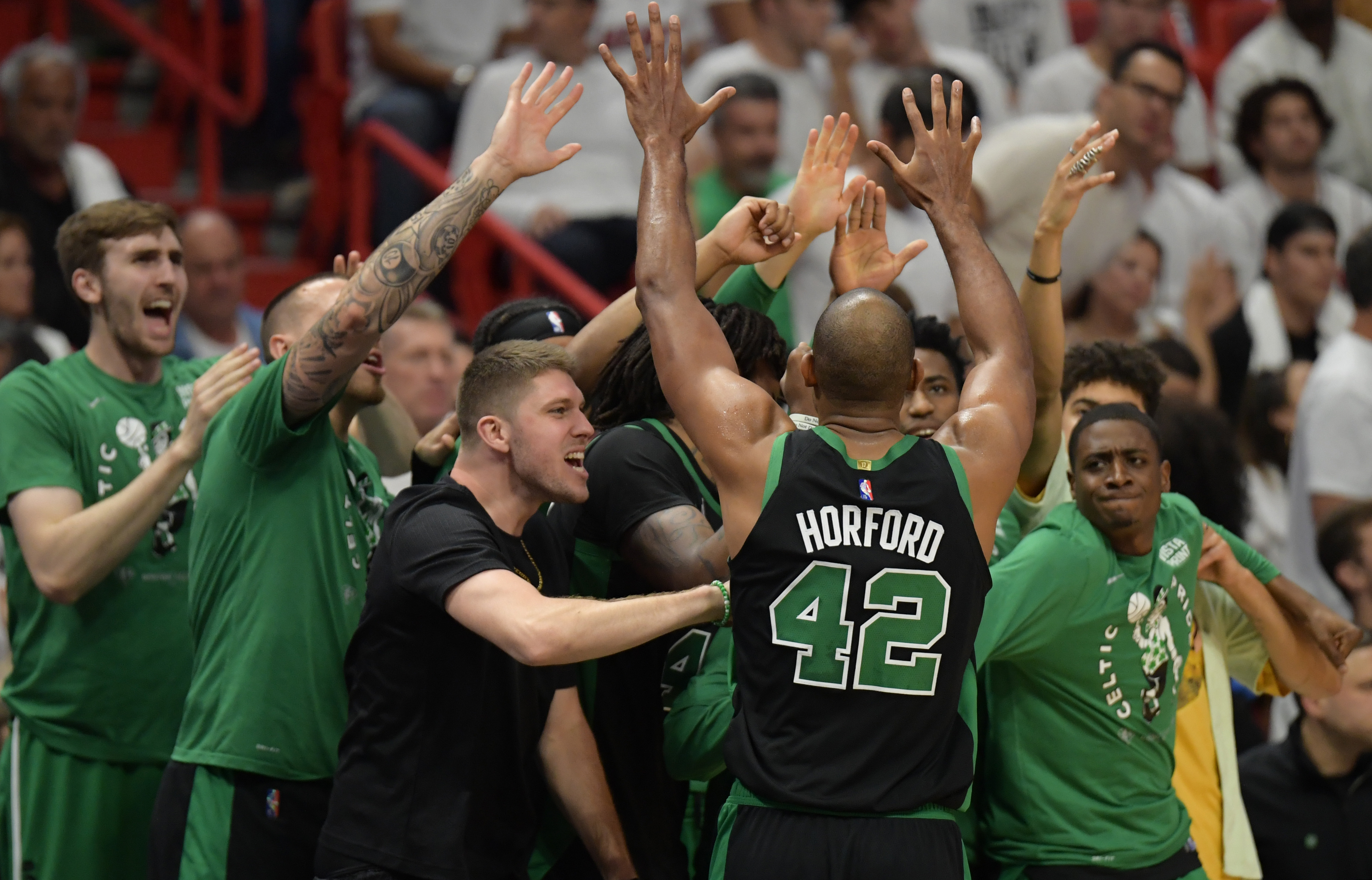 Boston Celtics center Al Horford, middle, celebrates with the Celtics bench during the second half of game five of the 2022 eastern conference finals at FTX Arena on May 25, 2022.