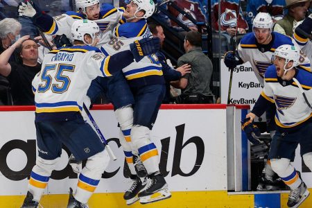 St. Louis Blues players smother center Tyler Bozak (center) after his game-winning overtime goal against the Colorado Avalanche in Game 5 of the second round of the 2022 Stanley Cup Playoffs