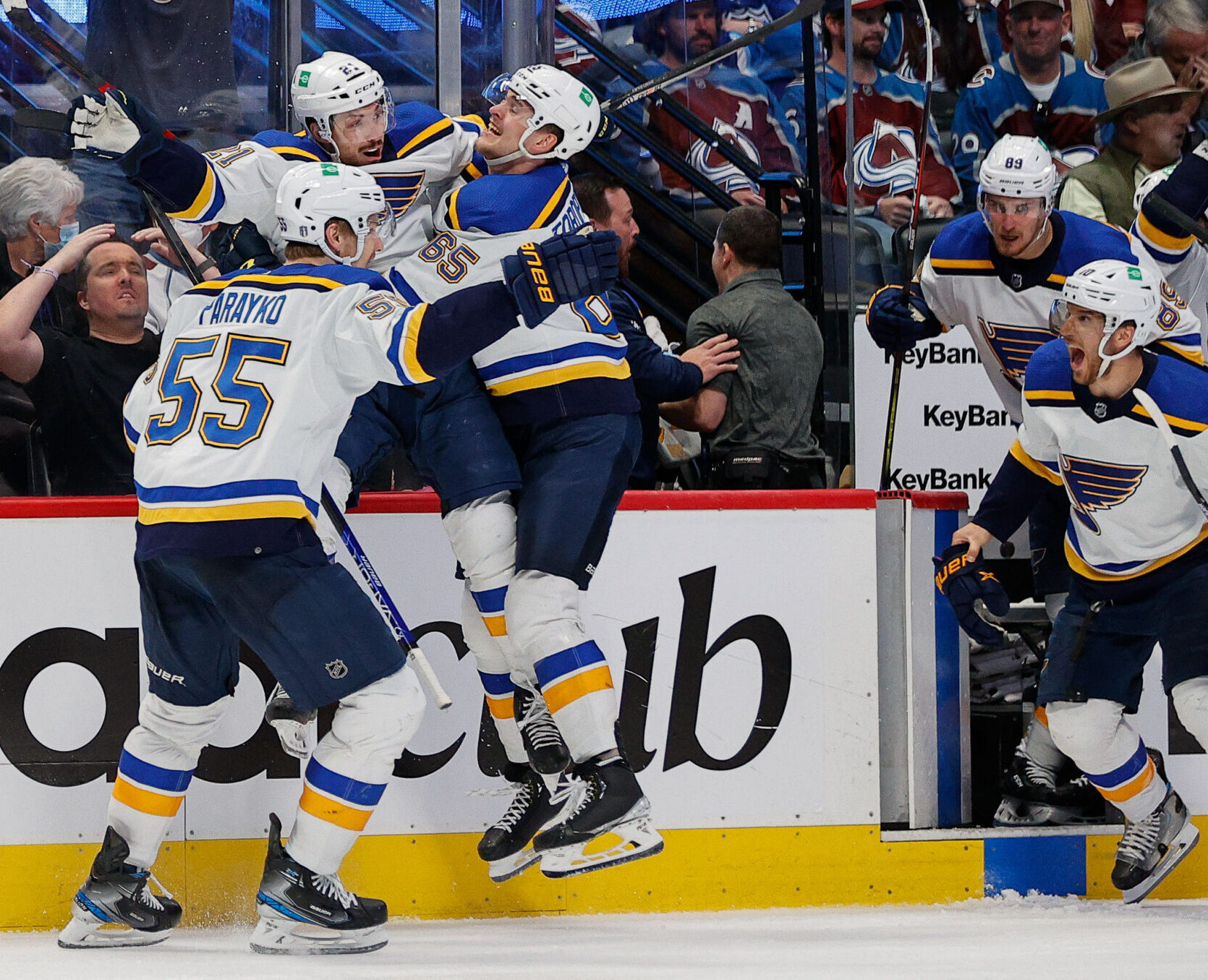 St. Louis Blues players smother center Tyler Bozak (center) after his game-winning overtime goal against the Colorado Avalanche in Game 5 of the second round of the 2022 Stanley Cup Playoffs