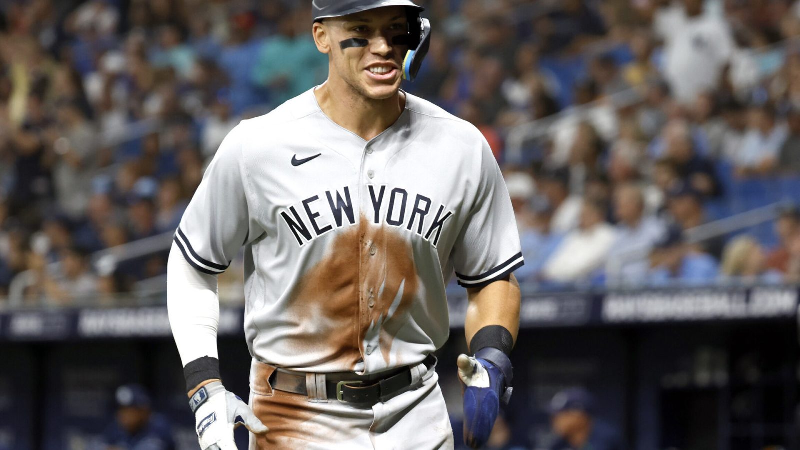 New York Yankees right fielder Aaron Judge smiles as he jogs to his dugout after scoring during the sixth inning against the Tampa Bay Rays
