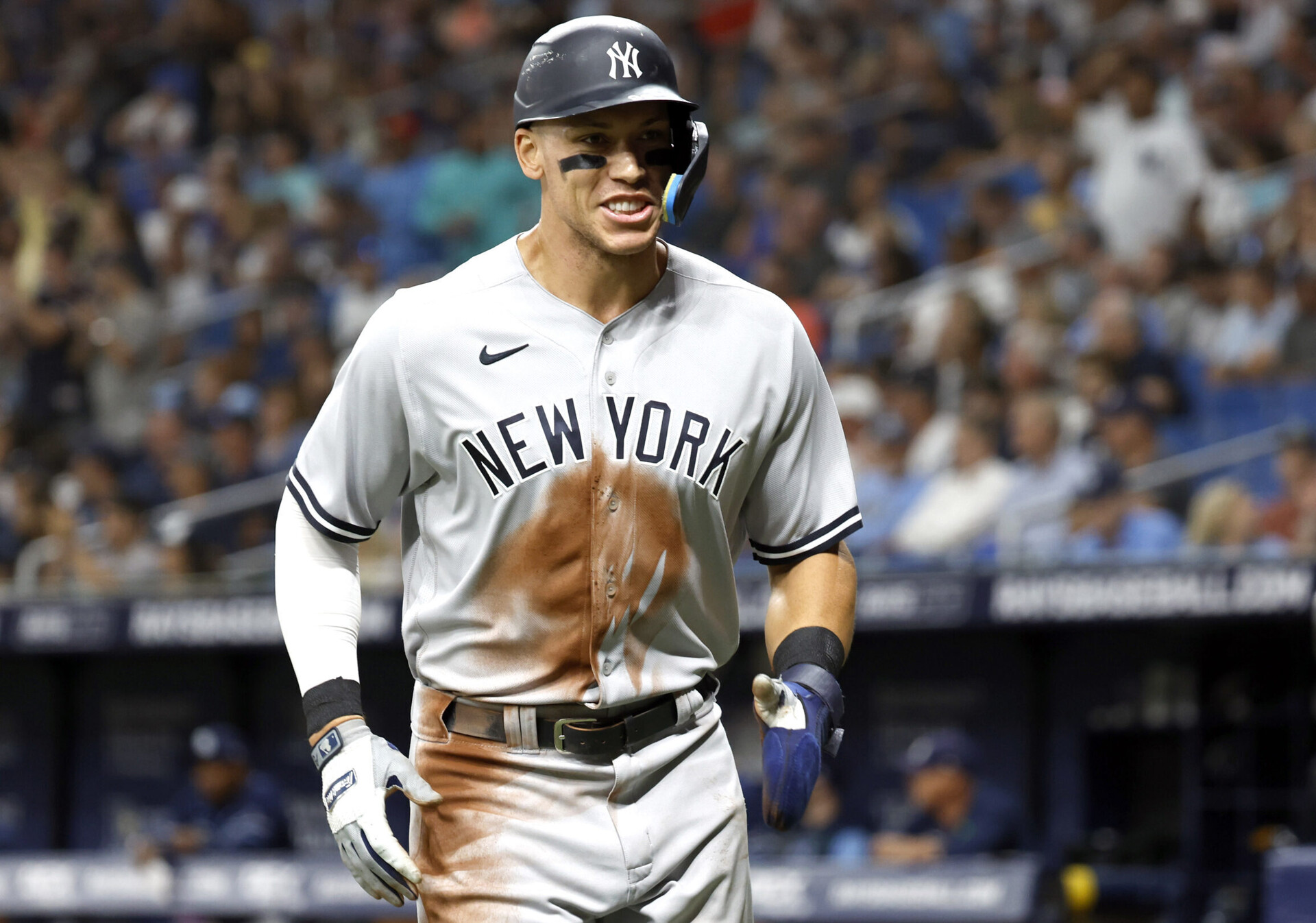 New York Yankees right fielder Aaron Judge smiles as he jogs to his dugout after scoring during the sixth inning against the Tampa Bay Rays