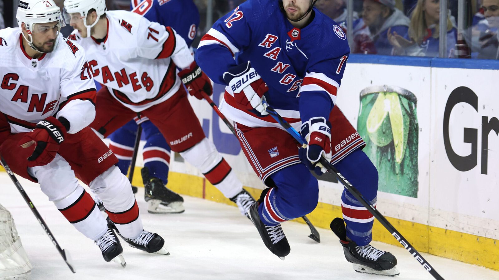 New York Rangers center Filip Chytil (right) controls the puck against Carolina Hurricanes right wing Nino Niederreiter (left) and right wing Jesper Fast (center) during Game 6 of the second round of the 2022 Stanley Cup Playoffs