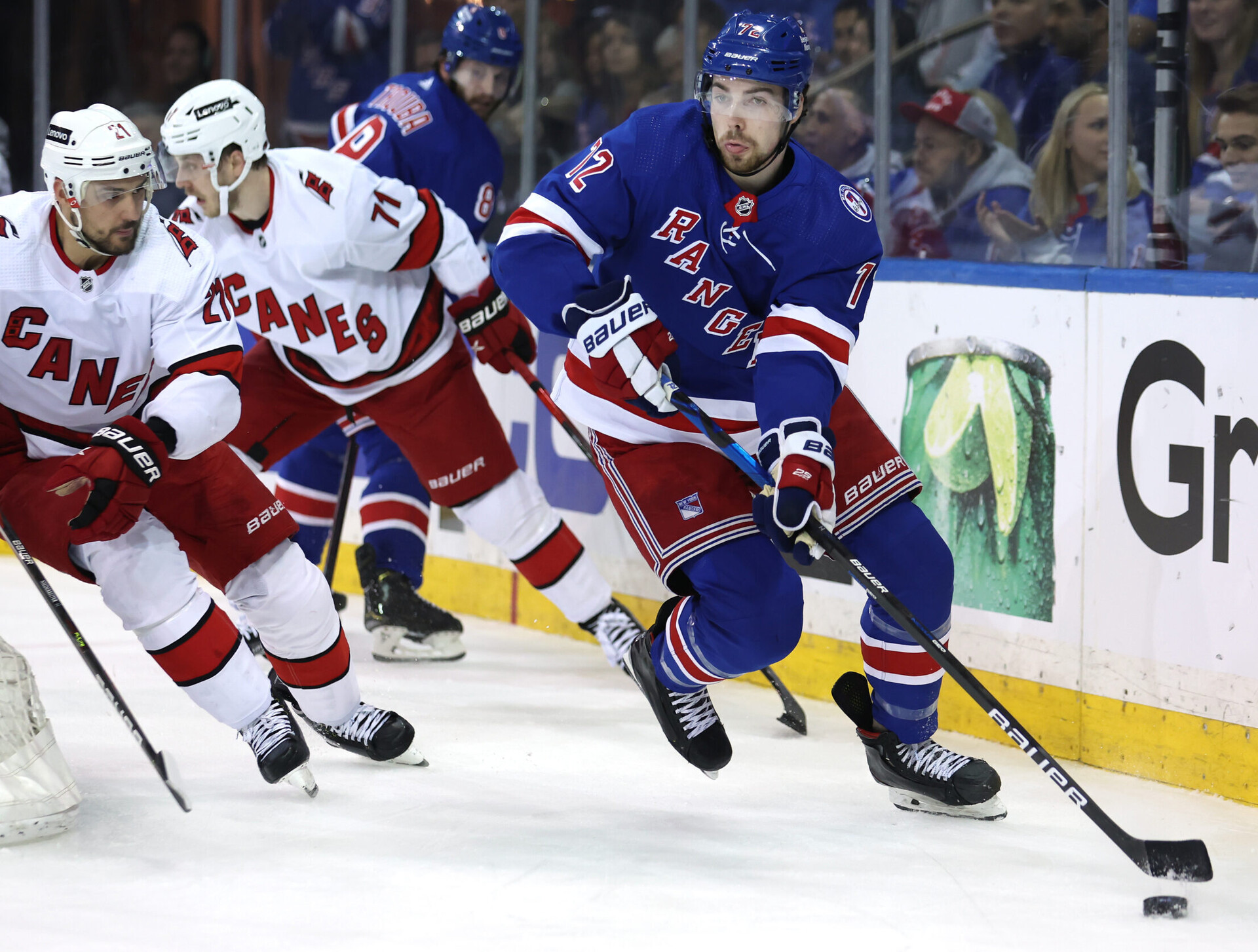 New York Rangers center Filip Chytil (right) controls the puck against Carolina Hurricanes right wing Nino Niederreiter (left) and right wing Jesper Fast (center) during Game 6 of the second round of the 2022 Stanley Cup Playoffs