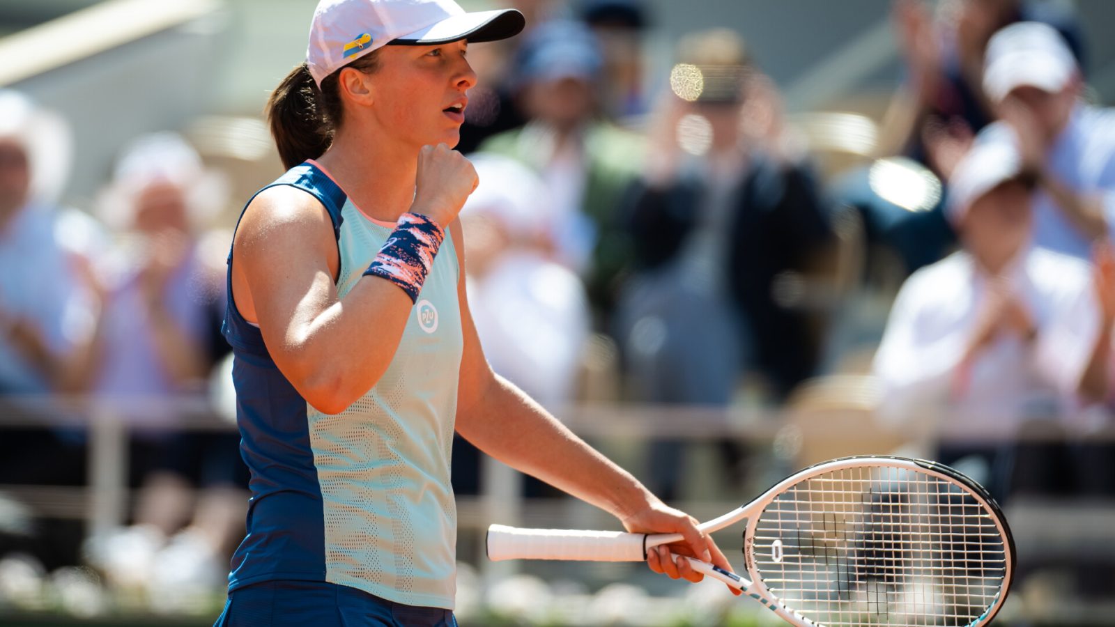 Iga Swiatek of Poland in action against Jessica Pegula of the United States in her quarter-final match on Day 11 at Roland Garros on June 01, 2022 in Paris, France