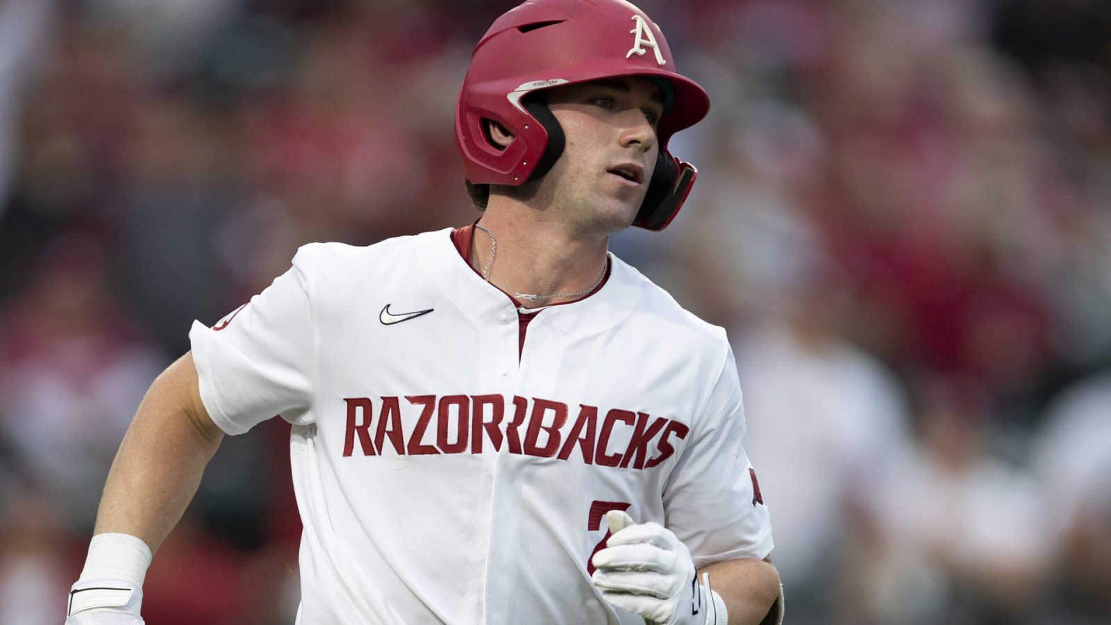 Cayden Wallace #7 of the Arkansas Razorbacks hits a home run during a game against the Florida Gators at Baum-Walker Stadium at George Cole Field on May 20, 2021 in Fayetteville, Arkansas. The Razorbacks defeated the Gators 6-1.