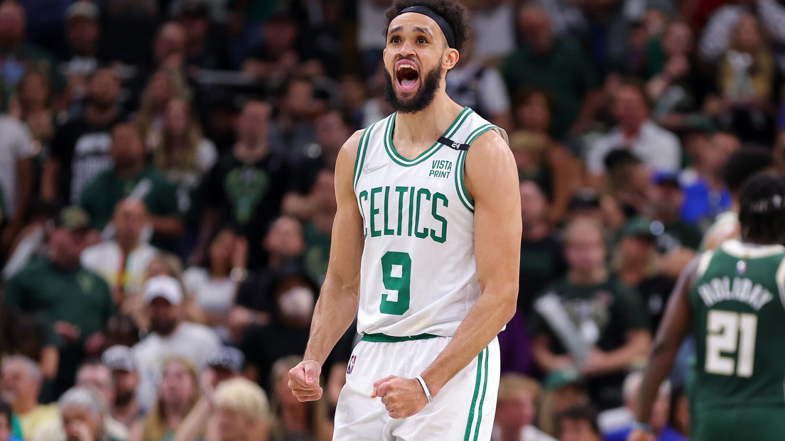 Derrick White #9 of the Boston Celtics reacts to a three point shot against the Milwaukee Bucks during the second half of Game Six of the Eastern Conference Semifinals at Fiserv Forum on May 13, 2022 in Milwaukee, Wisconsin.