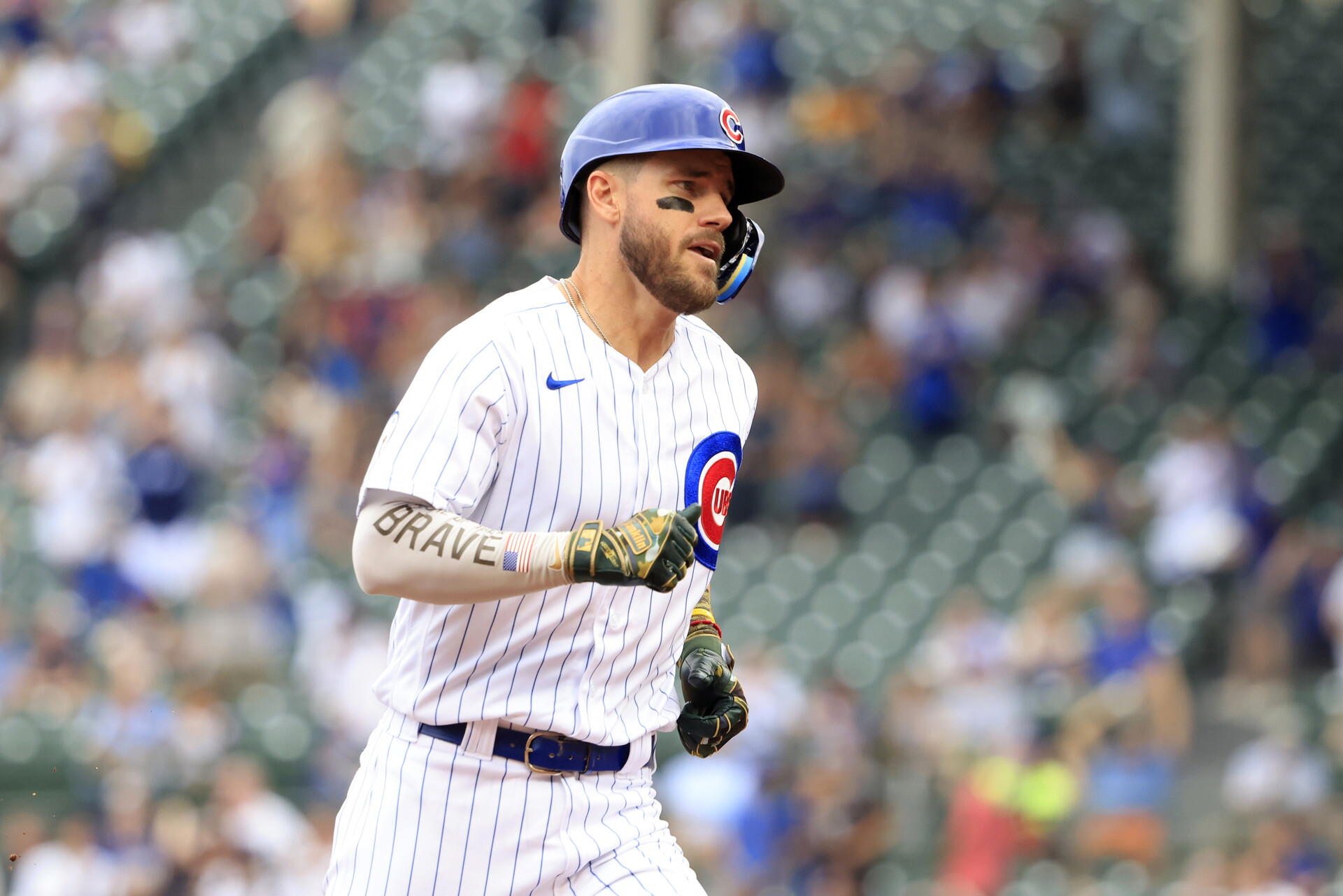 Patrick Wisdom #16 of the Chicago Cubs runs the bases after hitting a homerun during the second inning in the game against the Arizona Diamondbacks at Wrigley Field on May 20, 2022 in Chicago, Illinois.