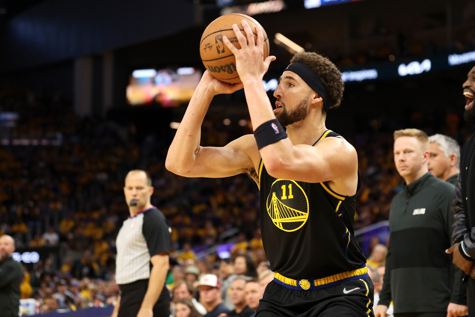 Klay Thompson #11 of the Golden State Warriors shoots a three point basket during the fourth quarter against the Dallas Mavericks in Game Five of the 2022 NBA Playoffs Western Conference Finals at Chase Center on May 26, 2022 in San Francisco, California. The Golden State Warriors won 120-110 to advance to the NBA Finals.