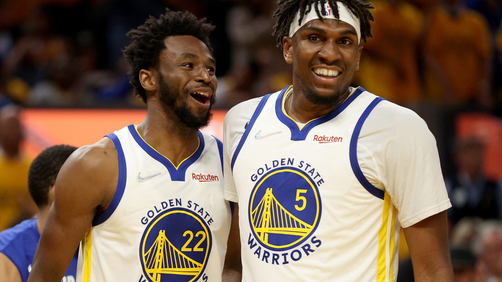 Andrew Wiggins #22 and Kevon Looney #5 of the Golden State Warriors react during the third quarter against the Boston Celtics in Game Two of the 2022 NBA Finals at Chase Center on June 05, 2022 in San Francisco, California.