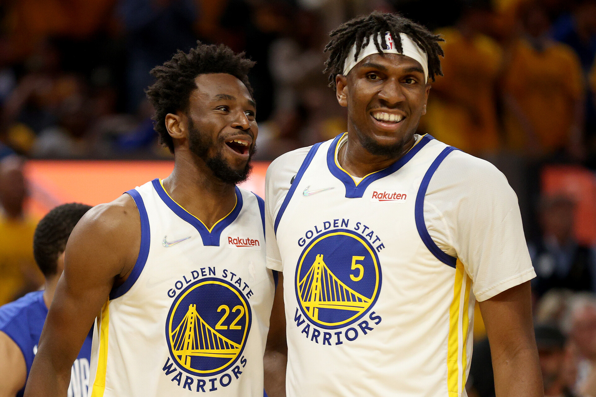 Andrew Wiggins #22 and Kevon Looney #5 of the Golden State Warriors react during the third quarter against the Boston Celtics in Game Two of the 2022 NBA Finals at Chase Center on June 05, 2022 in San Francisco, California.