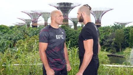 UFC light heavyweight champion Glover Texeira of Brazil and Jiri Prochazka of Czech Republic face off during a UFC photo session at Gardens by the Bay on June 7, 2022 in Singapore.