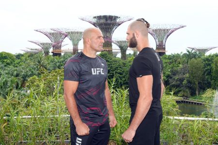 UFC light heavyweight champion Glover Texeira of Brazil and Jiri Prochazka of Czech Republic face off during a UFC photo session at Gardens by the Bay on June 7, 2022 in Singapore.