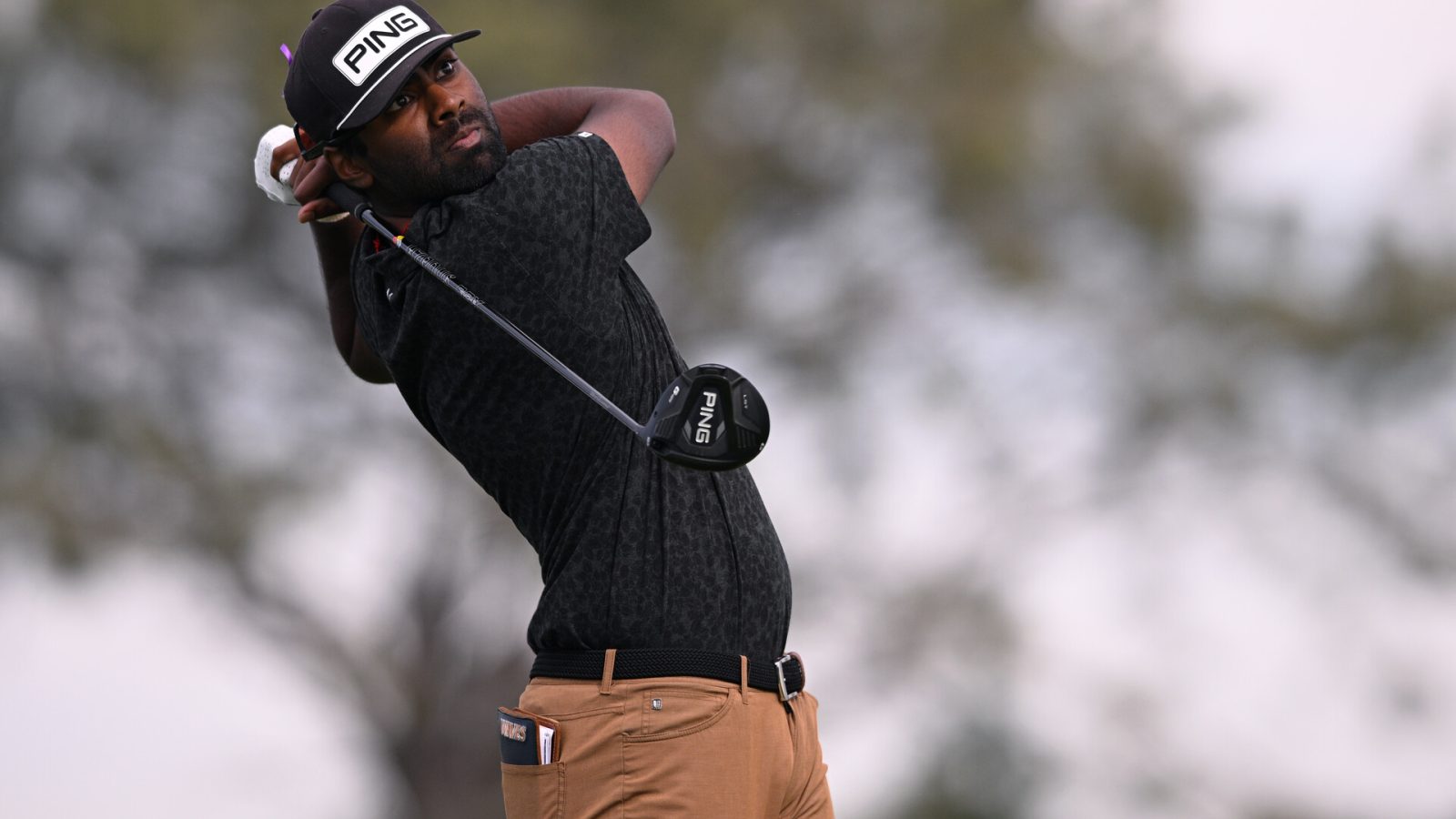 Sahith Theegala plays his shot from the second tee during the third round of the Farmers Insurance