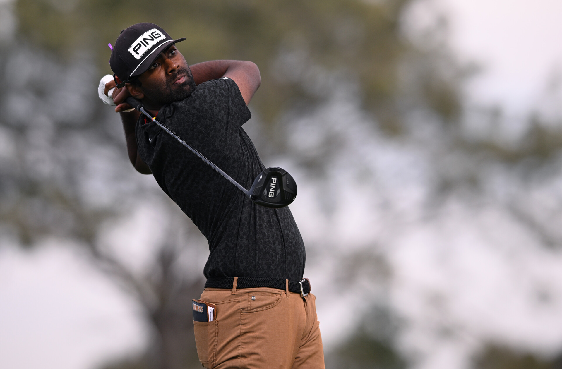 Sahith Theegala plays his shot from the second tee during the third round of the Farmers Insurance