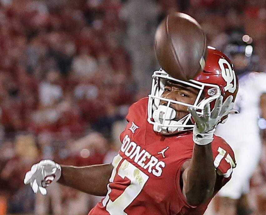 Oklahoma wide receiver Marvin Mims (17) reaches for the ball during a college football game between the University of Oklahoma Sooners (OU) and the TCU Horned Frogs at Gaylord Family-Oklahoma Memorial Stadium in Norman, Okla., Saturday, Oct. 16, 2021. Oklahoma won 52-31.