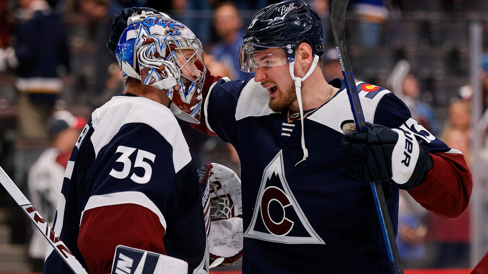 Colorado Avalanche right wing Valeri Nichushkin (13) celebrates with goaltender Darcy Kuemper (35) after the game against the St. Louis Blues at Ball Arena