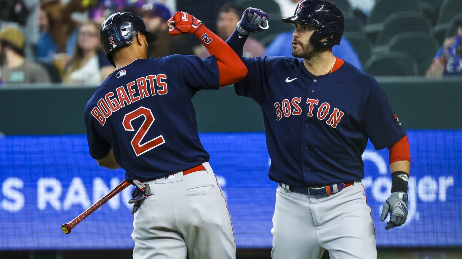 Boston Red Sox designated hitter J.D. Martinez (28) celebrates with Boston Red Sox shortstop Xander Bogaerts (2)