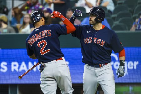 Boston Red Sox designated hitter J.D. Martinez (28) celebrates with Boston Red Sox shortstop Xander Bogaerts (2)