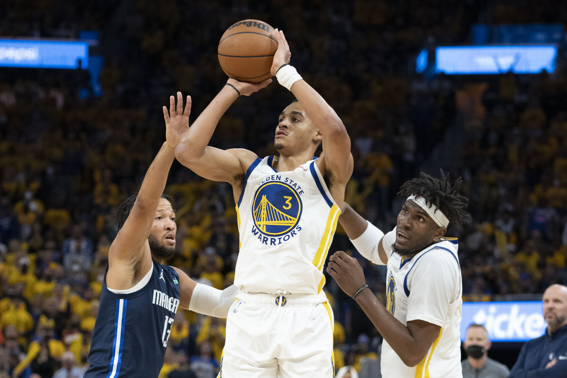 Golden State Warriors guard Jordan Poole (3) shoots the basketball against Dallas Mavericks guard Jalen Brunson (13) during the fourth quarter in game two of the 2022 western conference finals at Chase Center.