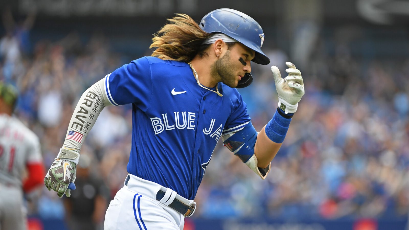 Toronto Blue Jays short stop Bo Bichette (11) rounds first after hitting a solo home run in the fourth inning against the Cincinnati Reds at Rogers Centre.