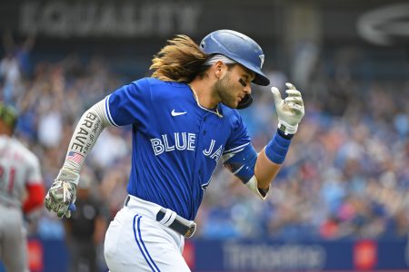 Toronto Blue Jays short stop Bo Bichette (11) rounds first after hitting a solo home run in the fourth inning against the Cincinnati Reds at Rogers Centre.