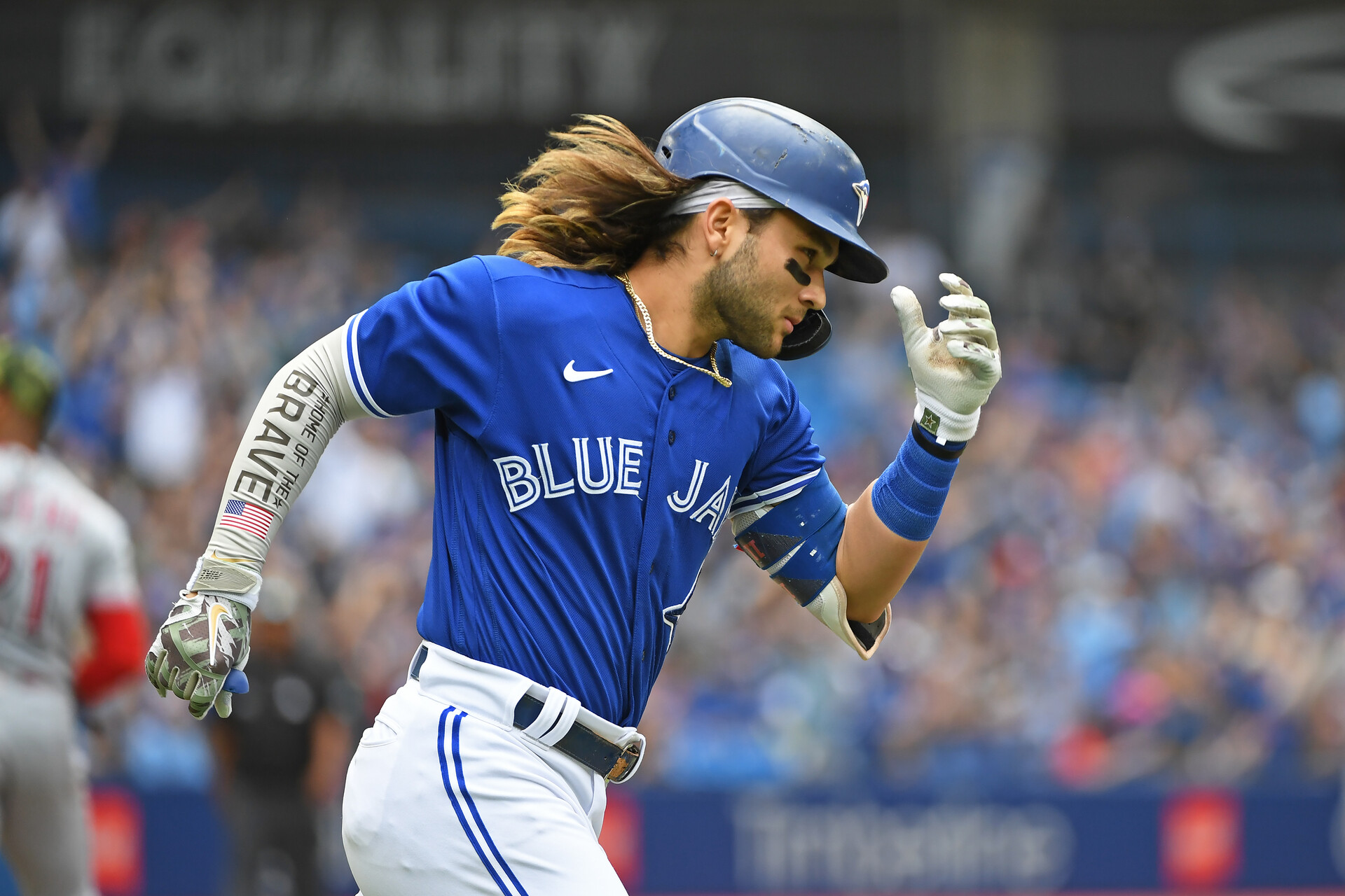 Toronto Blue Jays short stop Bo Bichette (11) rounds first after hitting a solo home run in the fourth inning against the Cincinnati Reds at Rogers Centre.