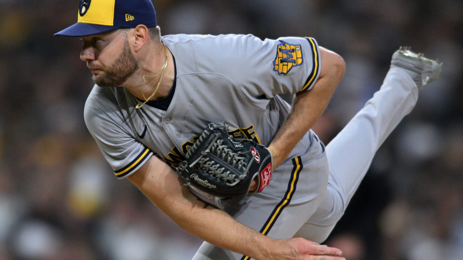 Milwaukee Brewers right-handed pitcher Adrian Houser follows through on a delivery with his right leg in the air May 23, 2022, in San Diego.
