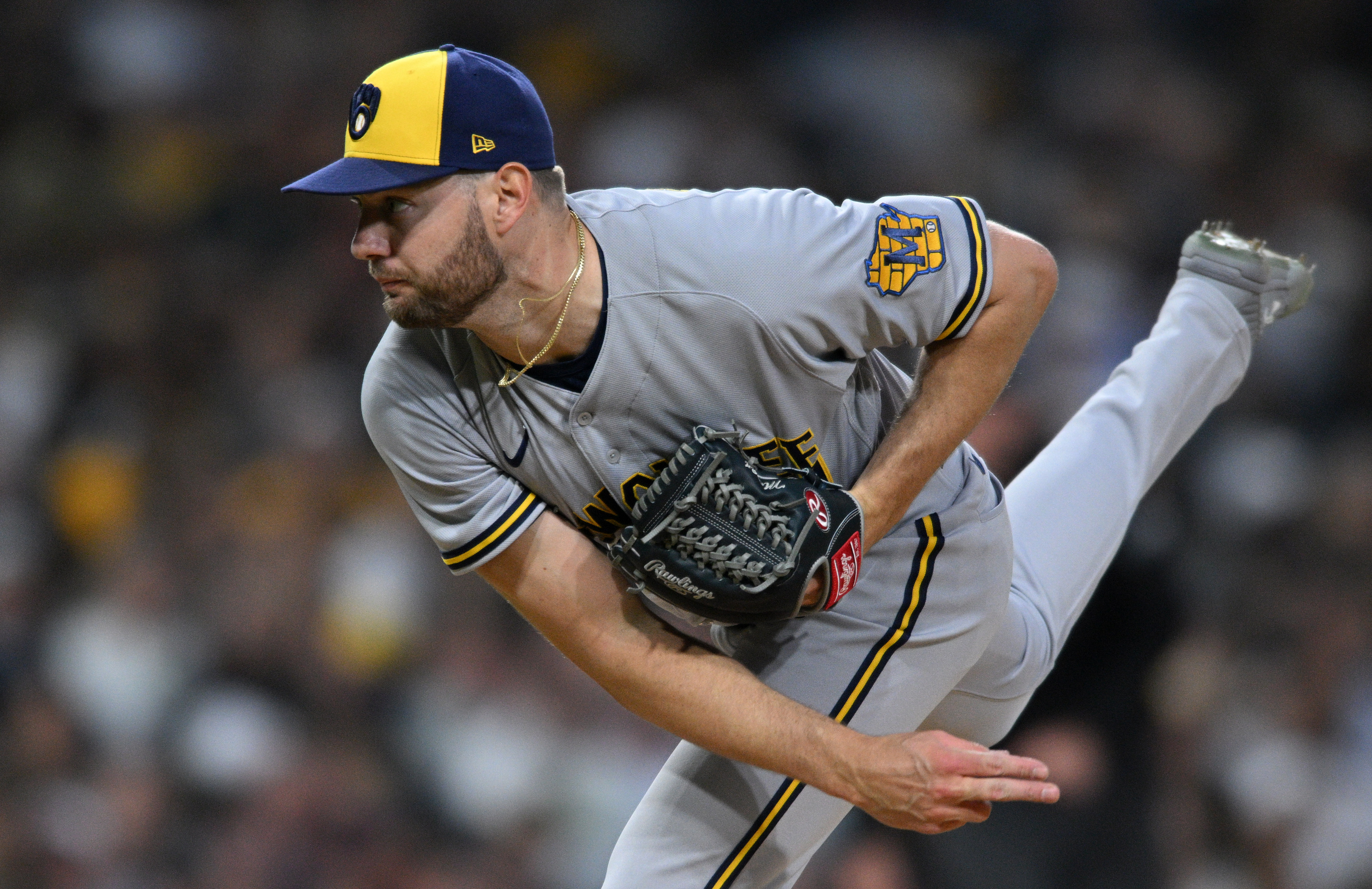 Milwaukee Brewers right-handed pitcher Adrian Houser follows through on a delivery with his right leg in the air May 23, 2022, in San Diego.