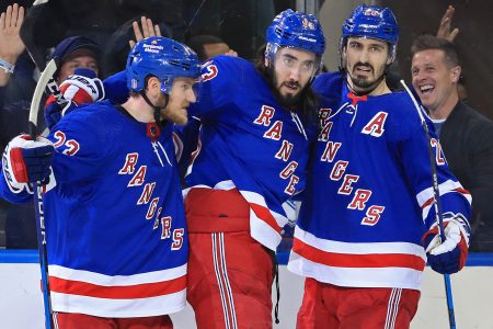 New York Rangers center Mika Zibanejad (center) celebrates his goal against the Tampa Bay Lightning with left wing Chris Kreider (left) and defenseman Adam Fox (right) in the third period of Game 1 of the Eastern Conference Final of the 2022 Stanley Cup Playoffs