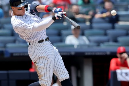 New York Yankees center fielder Aaron Judge connects with the baseball for a solo home run against the Los Angeles Angels