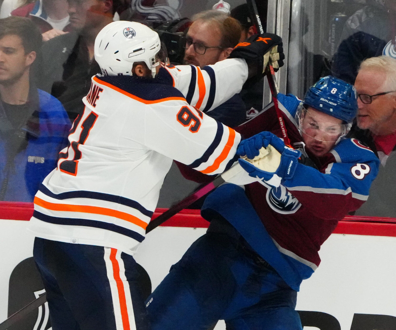 Edmonton Oilers left wing Evander Kane, left, hits Colorado Avalanche defenseman Cale Makar, right, in the third period of game two of the Western Conference Final of the 2022 Stanley Cup Playoffs at Ball Arena on June 2, 2022.