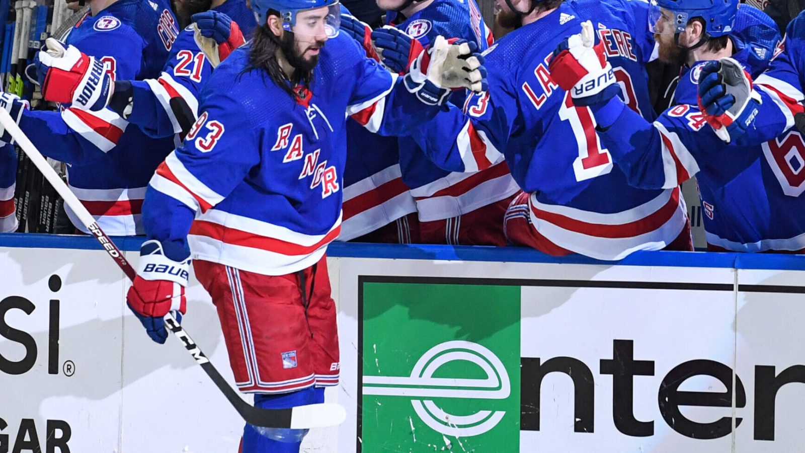New York Rangers center Mika Zibanejad (93) high-fives teammates on the bench after his goal against the Tampa Bay Lightning during Game 2 of the Eastern Conference Finals of the 2022 Stanley Cup Playoffs