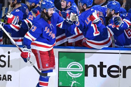 New York Rangers center Mika Zibanejad (93) high-fives teammates on the bench after his goal against the Tampa Bay Lightning during Game 2 of the Eastern Conference Finals of the 2022 Stanley Cup Playoffs