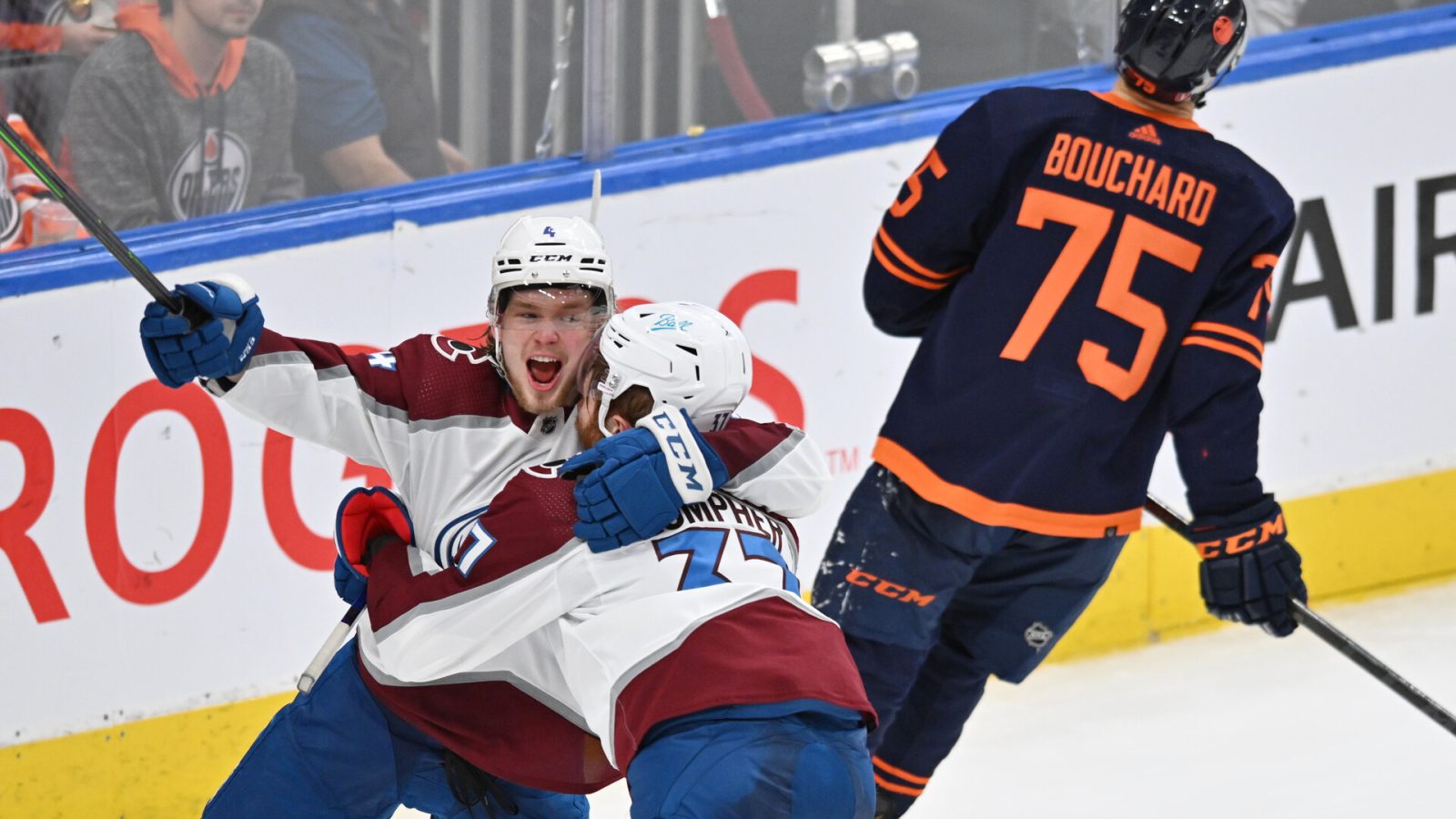 Colorado Avalanche left wing J.T. Compher (right) celebrates a goal with teammate Bowen Byram (left) as Edmonton defenseman Evan Bouchard skates away during Game 4 of the Western Conference Finals of the 2022 Stanley Cup Playoffs