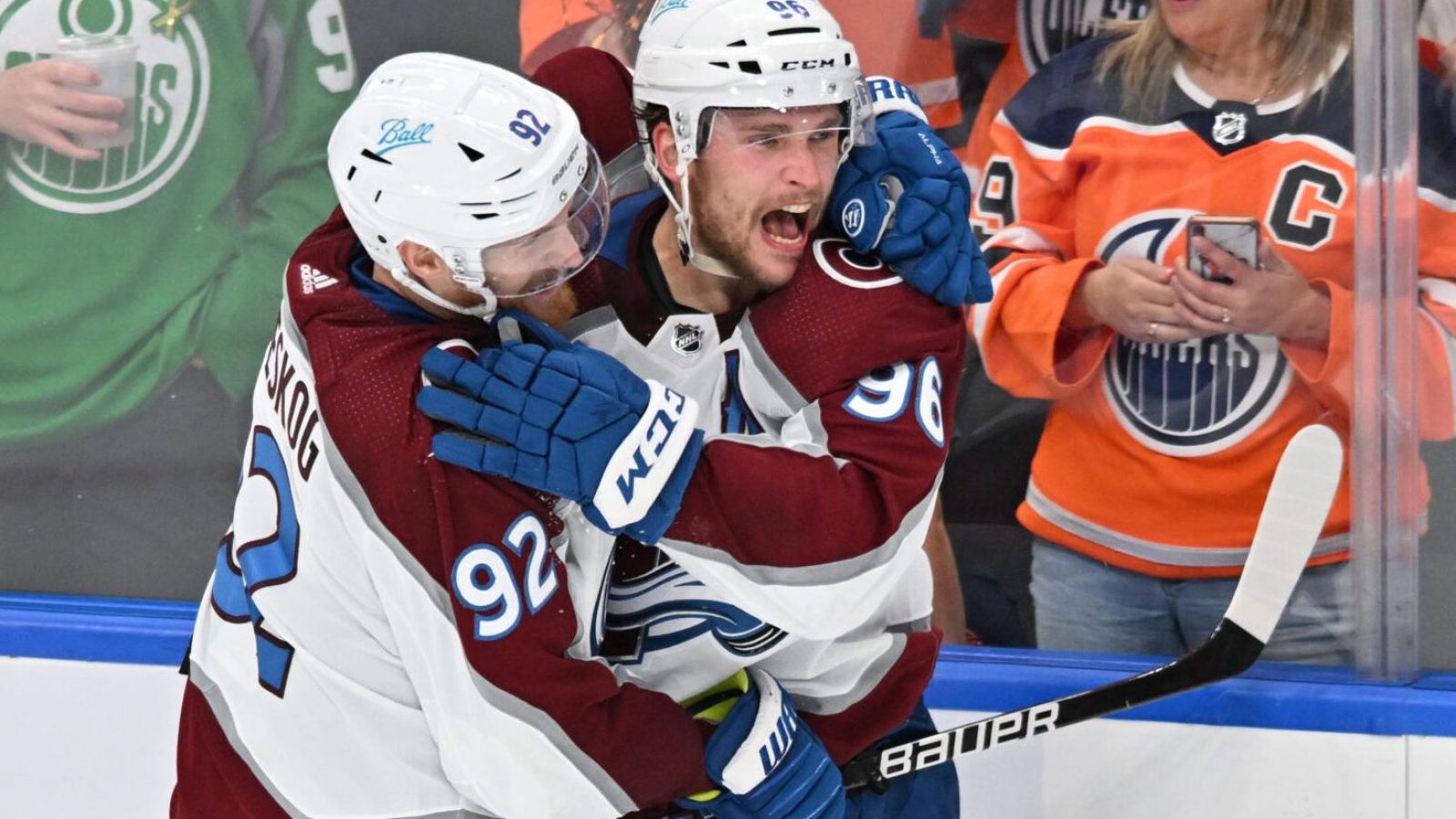 Colorado Avalanche teammates Mikko Rantanen, right, and Gabriel Landeskog, left, celebrate a win against the Edmonton Oilers in game three of the Western Conference Final of the 2022 Stanley Cup Playoffs at Rogers Place on June 4, 2022.