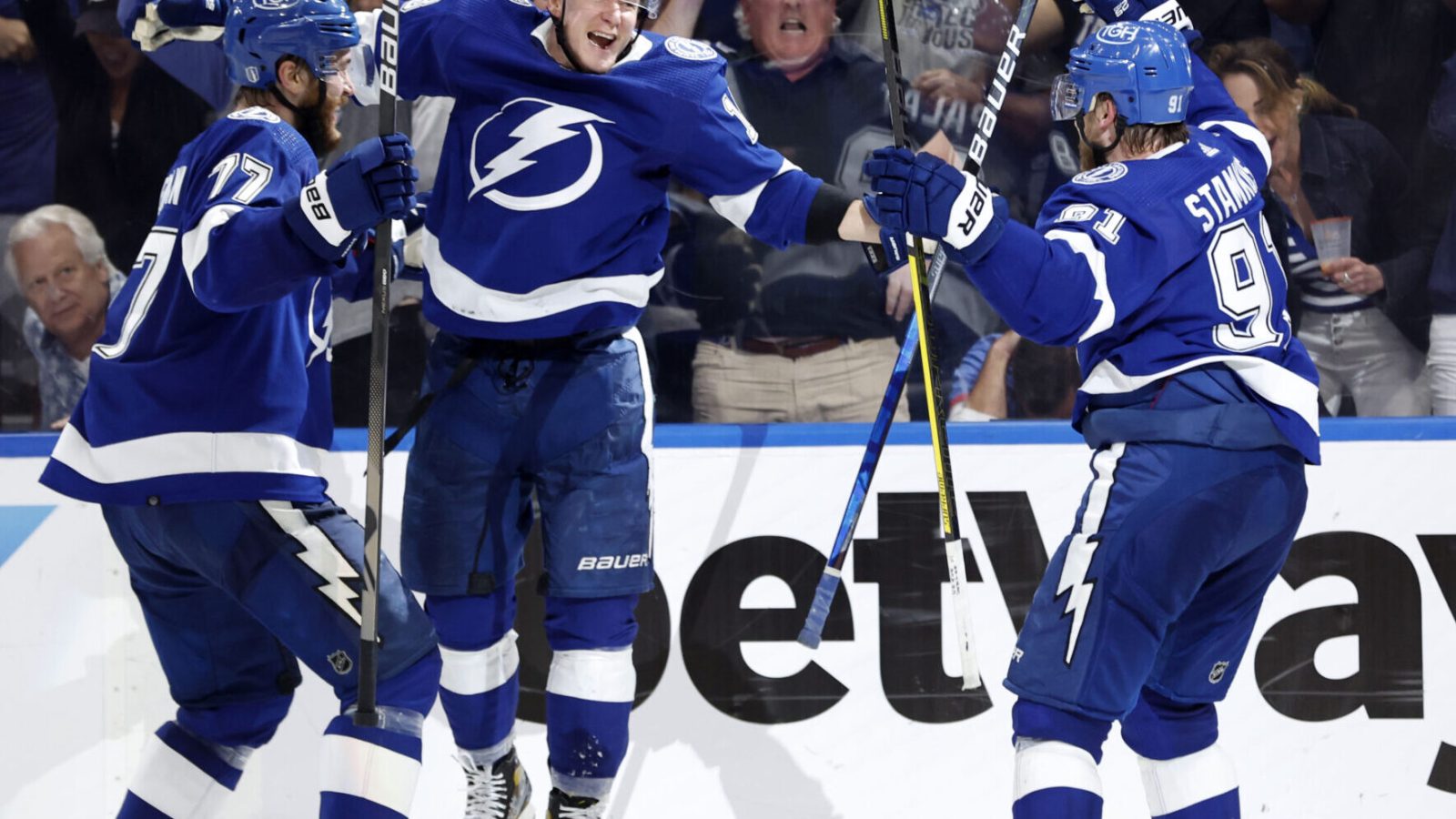 Tampa Bay Lightning left wing Ondrej Palat (center) celebrates with teammates Victor Hedman (left) and center Steven Stamkos (right) after scoring the game-winning goal against the New York Rangers in Game 3 of the Eastern Conference Final of the 2022 Stanley Cup Playoffs