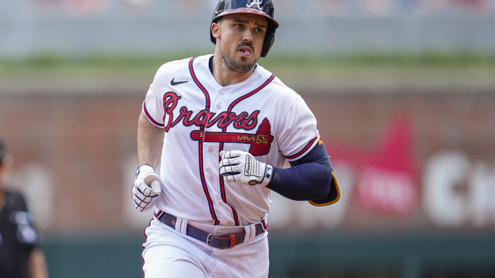 Atlanta Braves left fielder Adam Duvall (14) runs the bases after hitting a home run against the Pittsburgh Pirates during the second inning at Truist Park.