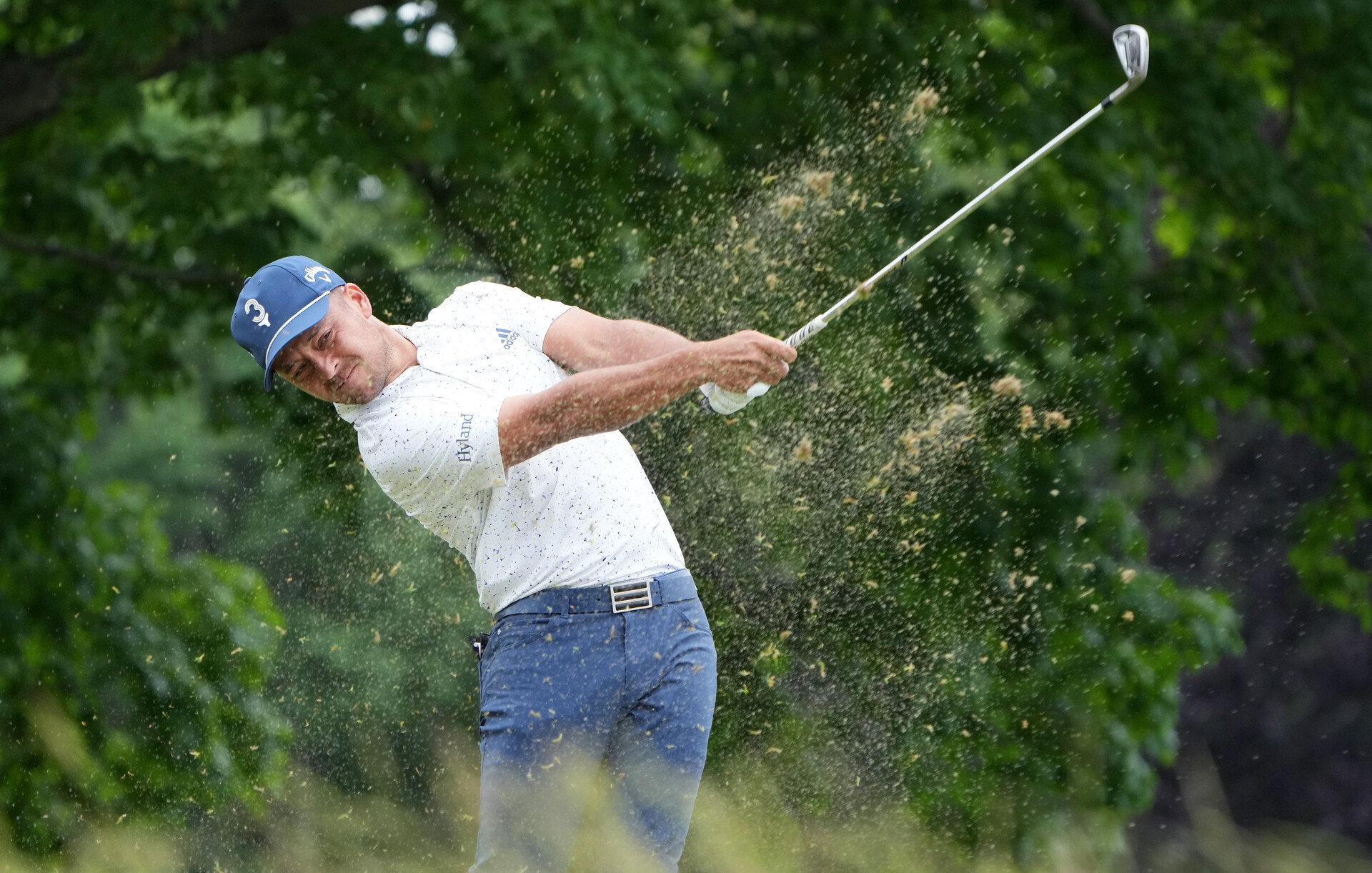 Xander Schauffele plays his shot from the sixth tee during the first round of the U.S. Open golf tournament.