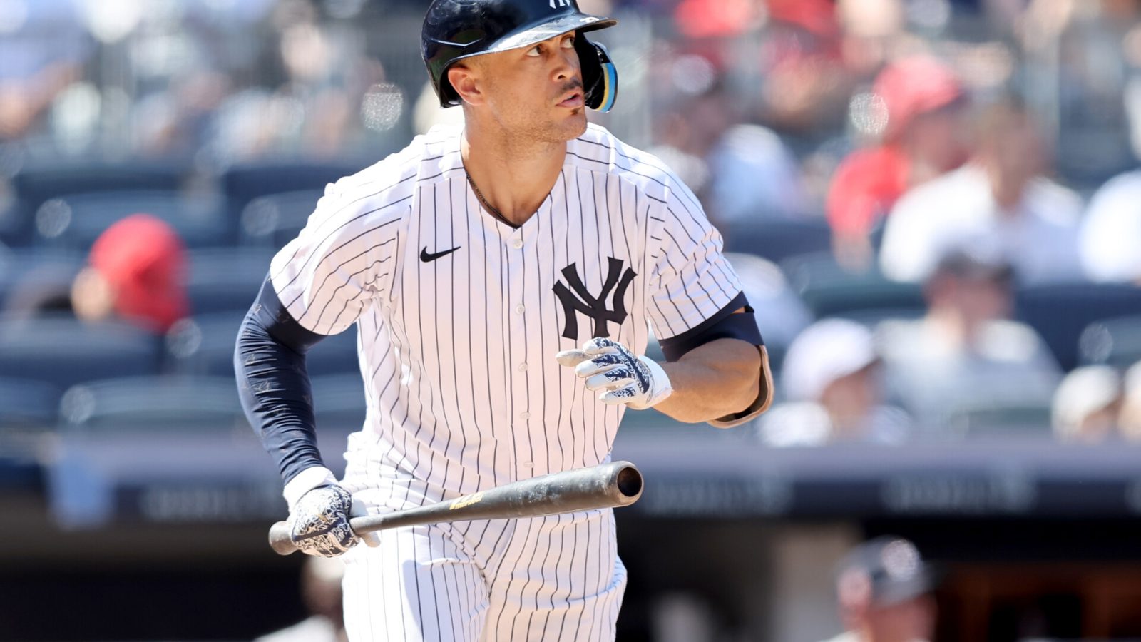 New York Yankees right fielder Giancarlo Stanton (27) runs to first after hitting a solo home run against the Houston Astros during the seventh inning at Yankee Stadium.
