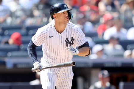 New York Yankees right fielder Giancarlo Stanton (27) runs to first after hitting a solo home run against the Houston Astros during the seventh inning at Yankee Stadium.